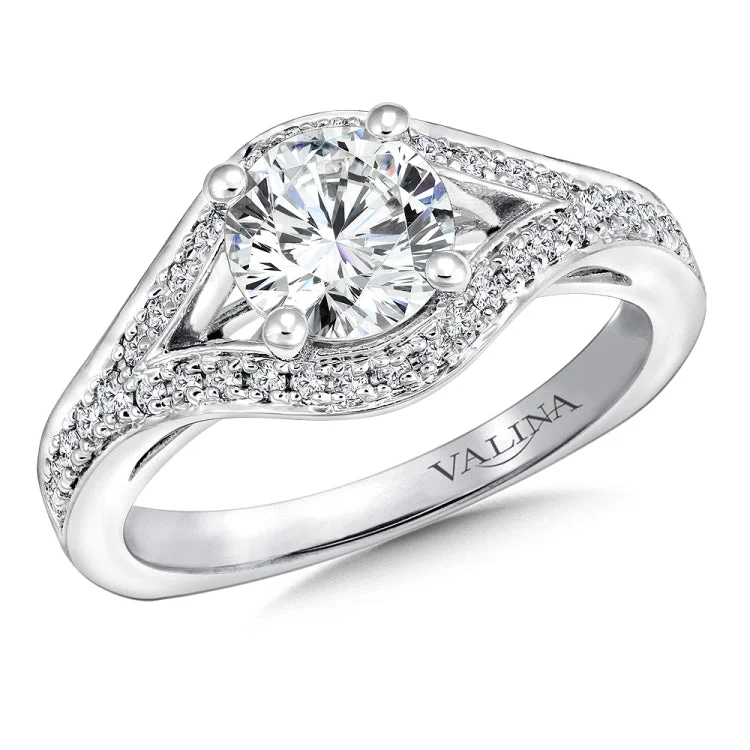 Raised diamond shoulders sweep up and suspend the stunning center stone in this sleek dramatic design.