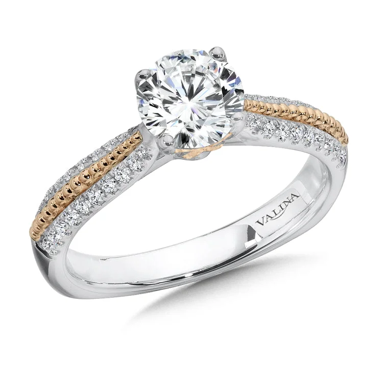 Diamond engagement ring mounting with beaded rose gold detailing and side stones set in 14k white gold.