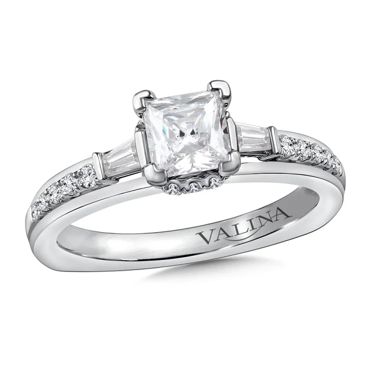 Diamond engagement ring mounting with baguette and round side stones set in 14k white gold.