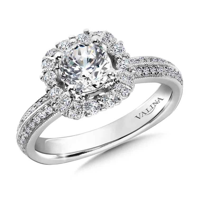 Diamond halo engagement ring mounting with side stones set in 14k white gold.